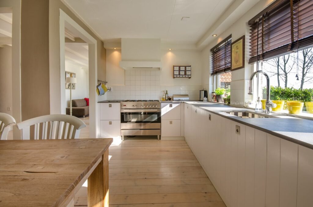 Kaff chimneys, hobs, microwave ovens, built-in ovens, dishwashers, cooktops, and gas stoves in a sleek modern kitchen.