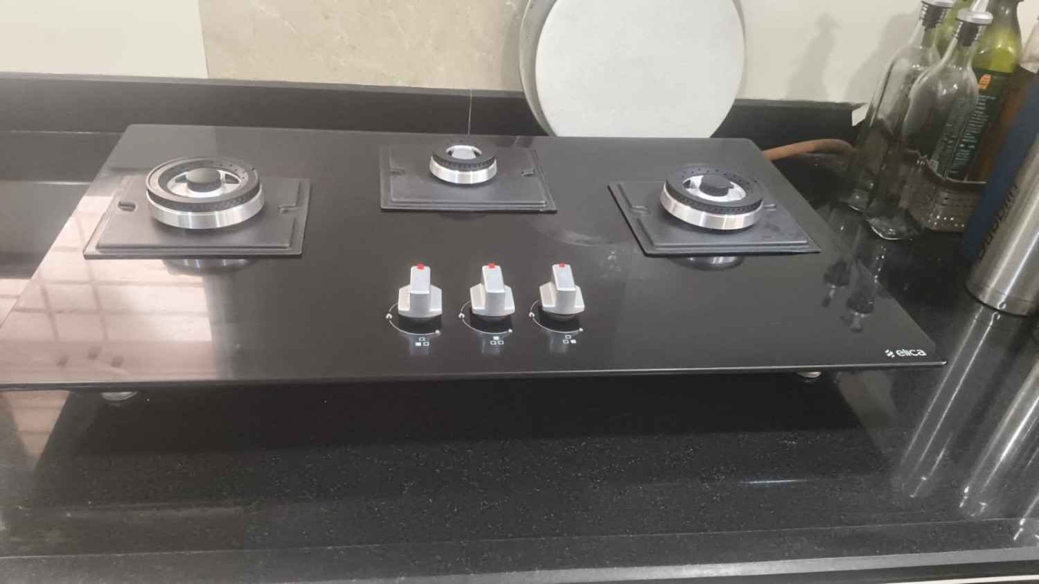 Hob repair service technician fixing gas burner