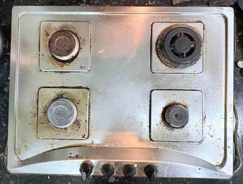 Technician repairing a gas hob in a Hyderabad kitchen